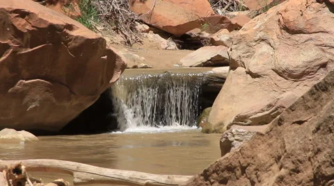 Virgin River pours into a small waterfall within Zion National Park Stock Footage 40715243