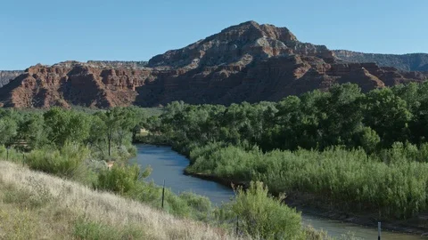 Virgin River with red rock mountains in the background, afternoon. Stock Footage 88276091