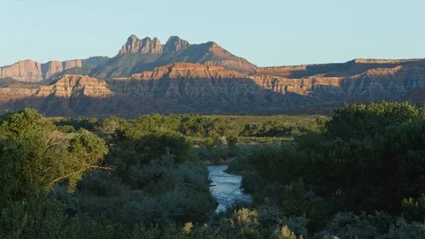 Virgin River with trees and dramatic Mountains in the background, Utah Stock Footage 88272814