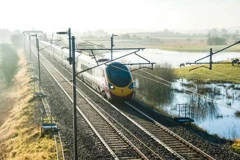 Virgin Train Express passenger train in the countryside Stock Photos
