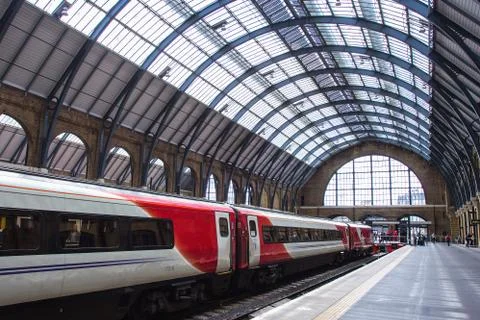 Virgin train is at The Kings Cross train Station in central London. Stock Photos
