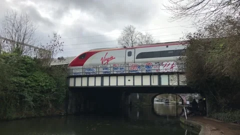 Virgin Train passing over bridge Stock Footage 136968978