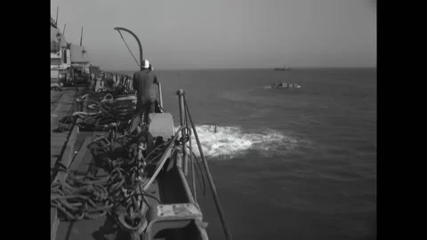 VIRGINIA - 1950 - The ship maneuvers through the sea, with shells exploding in Stock Footage 296692094