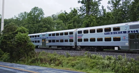 Virginia Railway Express (VRE) train heading into Washington DC - commuter rail Stock Footage 146046629