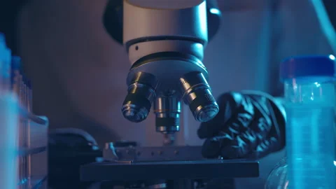 Virologist scientist using microscope in laboratory. Biochemical and medical 動画素材 297455106