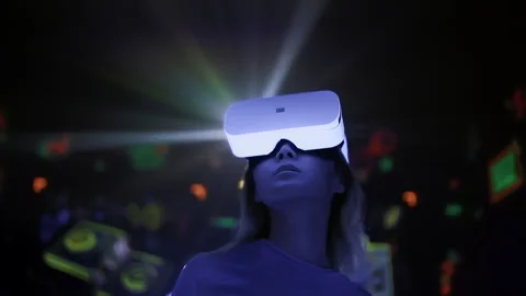 Virtual and augmented reality. Young asian woman wears VR headset in cyber space Stock Footage 229699082