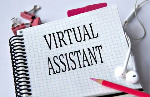 VIRTUAL ASSISTANT - words in a white notebook on a white background with he.. Stock Photos