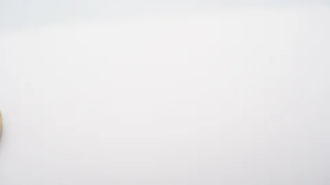 Virtual bit-coin coin appearing on a white background Stock Footage 124807994