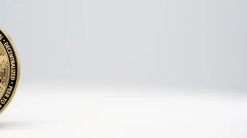 Virtual bit-coin coin appearing on a white background Stock Footage 124808636