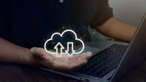 Virtual cloud in hand with laptop on table, cloud computing technology for .. Stock Photos