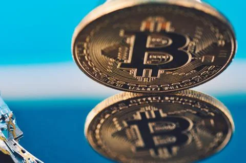 Virtual Cryptocurrency and Blockchain Technology concept, golden bitcoin on d Stock Photos