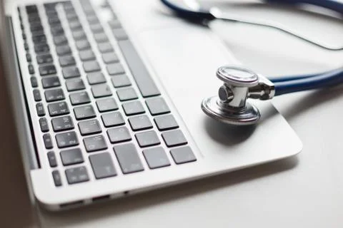 Virtual doctor. Computer and stethoscope Stock Photos