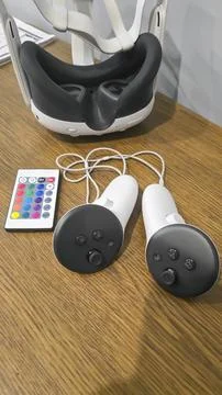 Virtual game set. VR headset. Glasses are on the table next to the control pa Stock Photos