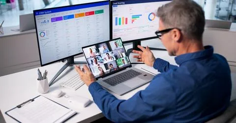 Virtual Meeting: Business Manager Using Online Video Conferencing Software On Stock Photos