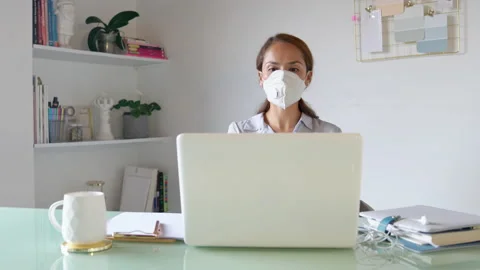 Virtual meeting explaining how to use safety mask Stock Footage 130591840