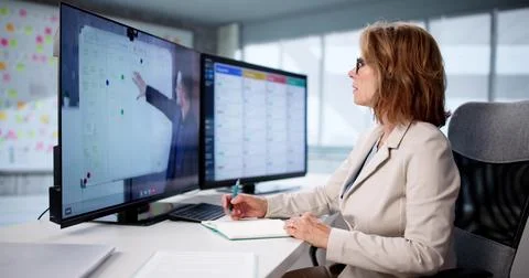 Virtual Online Training Session Helps Woman Learn Digital Management Skills Stock Photos