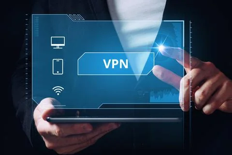 Virtual Private Network or VPN. The person connects the computer, phone Stock Photos