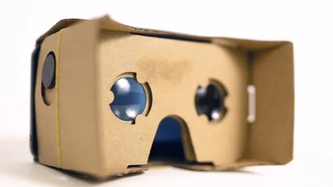 Virtual reality cardboard glasses on the table. Blue lenses. Stock Footage 88925830