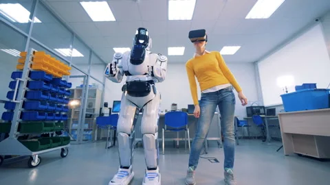 Virtual reality concept. Female in VR glasses makes dancing movements and a Video stock 91209111