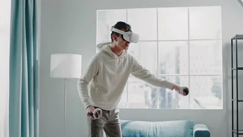 Virtual reality developer tests new headset and moves hands Stock Footage 152148136