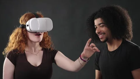 Virtual Reality Experience And Metaverse Concept, Young Couple Interacting With Stock Footage 335932196