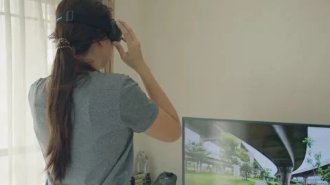 Virtual Reality Experience with Headset and Screen Stock Footage 314902065