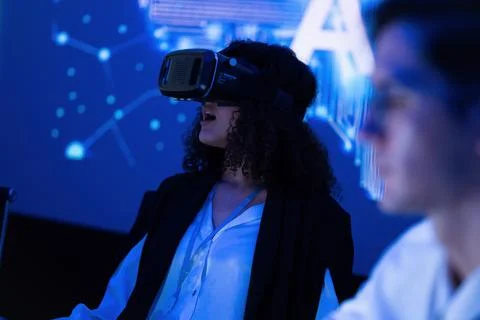 Virtual reality experience at a tech event with a participant immersed in a.. Stock Photos