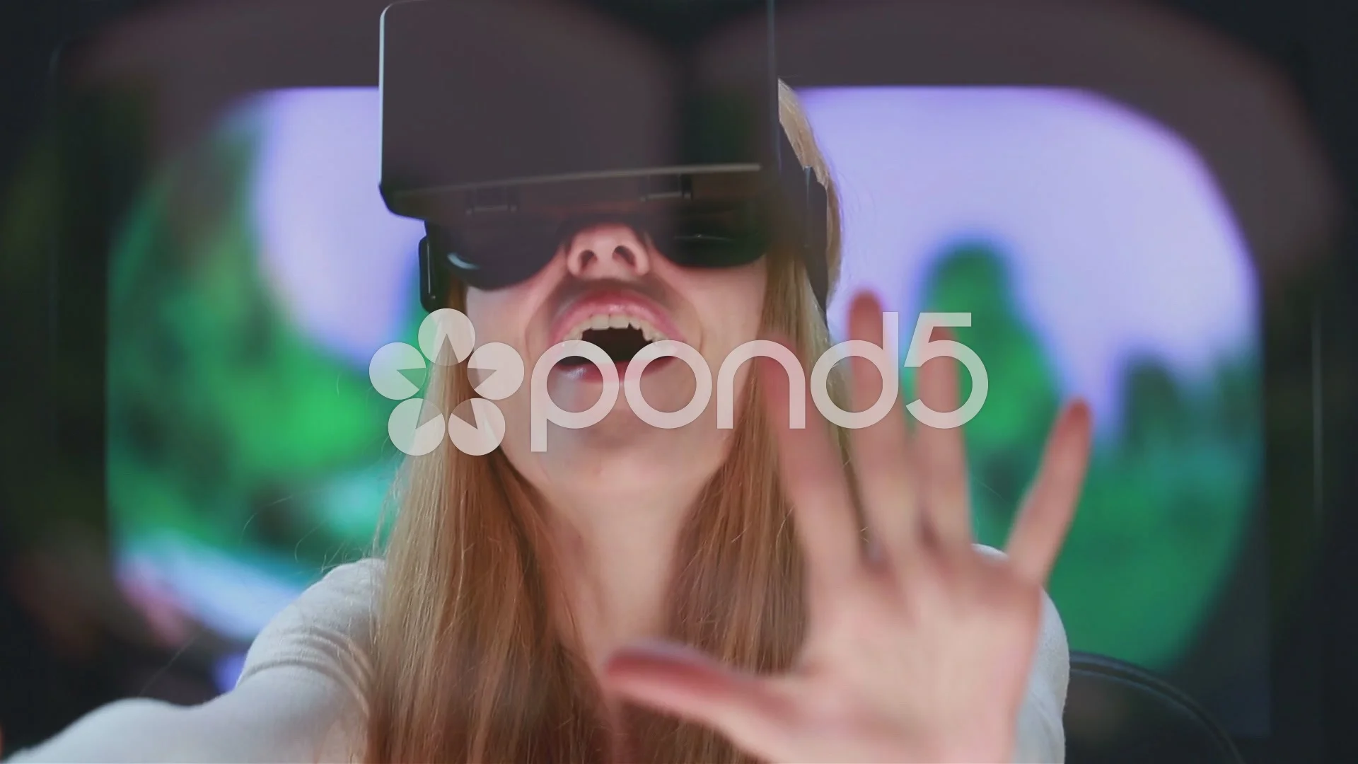 Virtual reality game. Girl with pleasure uses head-mounted display.