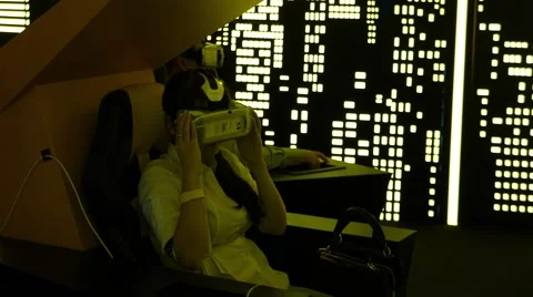 Virtual reality game. Girl with pleasure uses head-mounted display 스톡 동영상 59589673