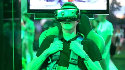 Virtual reality game. Man uses head mounted display Exhibition Stock Footage 95885797