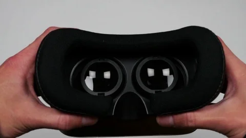 Virtual reality glasses moving towards a camera. Close up Stock Footage 75298172