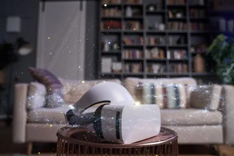 Virtual reality glasses on the table against the apartment on background Stock Photos