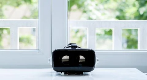 Virtual reality glasses on white table Stock Photos