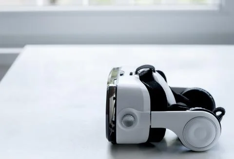 Virtual reality glasses on white table Stock Photos