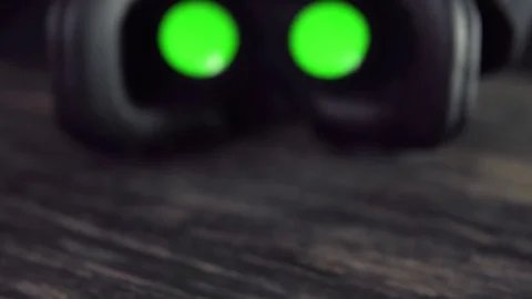 Virtual reality headset on black table. VR headset affords graphical experience Video stock 75003503