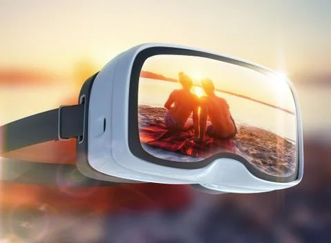 Virtual reality headset, double exposure, Romantic couple on the beach at col Stock Photos