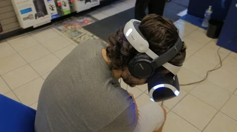 Virtual Reality Headset Experience Male Sony Playstation VR Store Demo 스톡 동영상 65881319