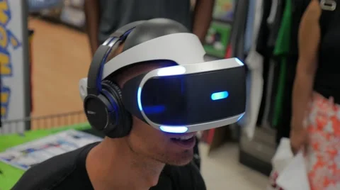 Virtual Reality Headset Experience Male Sony Playstation VR Store Demo Stock Footage