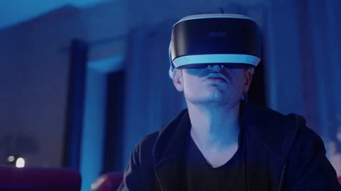 Virtual Reality Man using Smartphone in a blue room Vídeo Stock 258551756