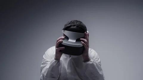 Virtual Reality Man in white coat against white background Stock Footage 258545428