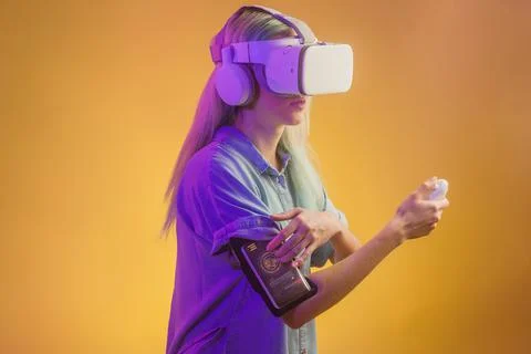 Virtual reality technology headset glasses. Latin futuristic cyberpunk female in Stock Photos