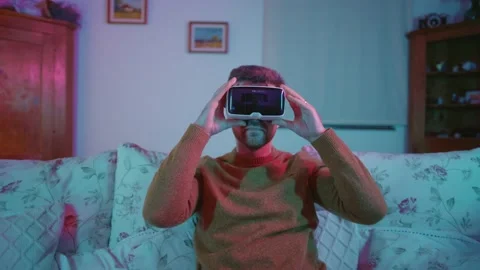 Virtual Reality VR Metaverse Headset Man Playing Games Exploring Worlds Vídeo Stock 195288395