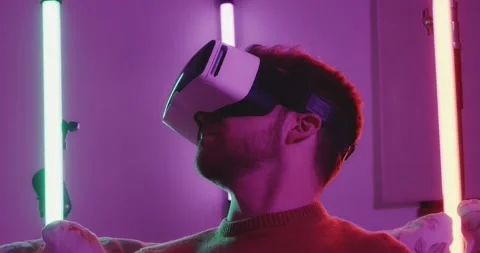 Virtual Reality VR Metaverse Headset Man Playing Games Exploring Worlds Stock-Footage 195288954