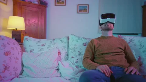 Virtual Reality VR Metaverse Headset Man Playing Games Exploring Worlds Video stock 195289753