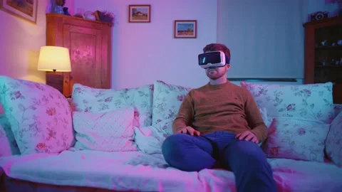 Virtual Reality VR Metaverse Headset Man Playing Games Exploring Worlds Video stock 195289770