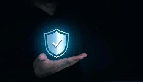 A virtual shield lock icon with the correct sign appeared on the human's hand Stock Photos