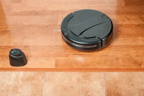 Virtual wall does not let vacuum cleaner on tile floor. Barrier uses infrared Stock Photos