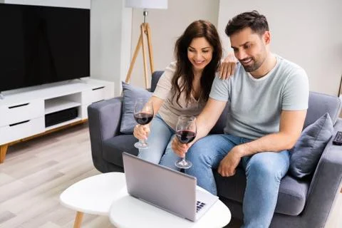 Virtual Wine Tasting Using Laptop. Online Party Stock Photos