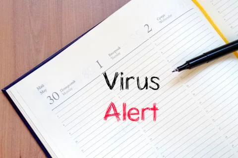 Virus alert text concept on notebook Stock Photos