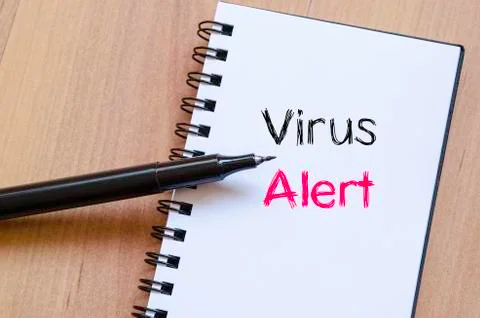 Virus alert text concept on notebook Stock Photos